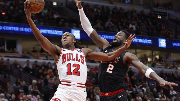 Chicago Bulls guard Ayo Dosunmu (12) goes to the basket against Portland Trail Blazers center Deandre Ayton (2) during the first half at United Center.